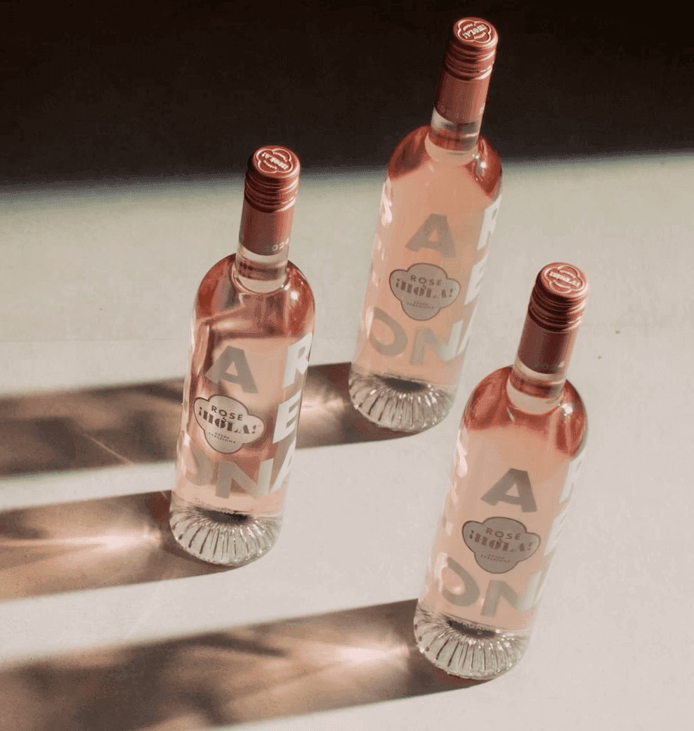 Three signature Rosé by HOLA Barcelona bottles in sunlight